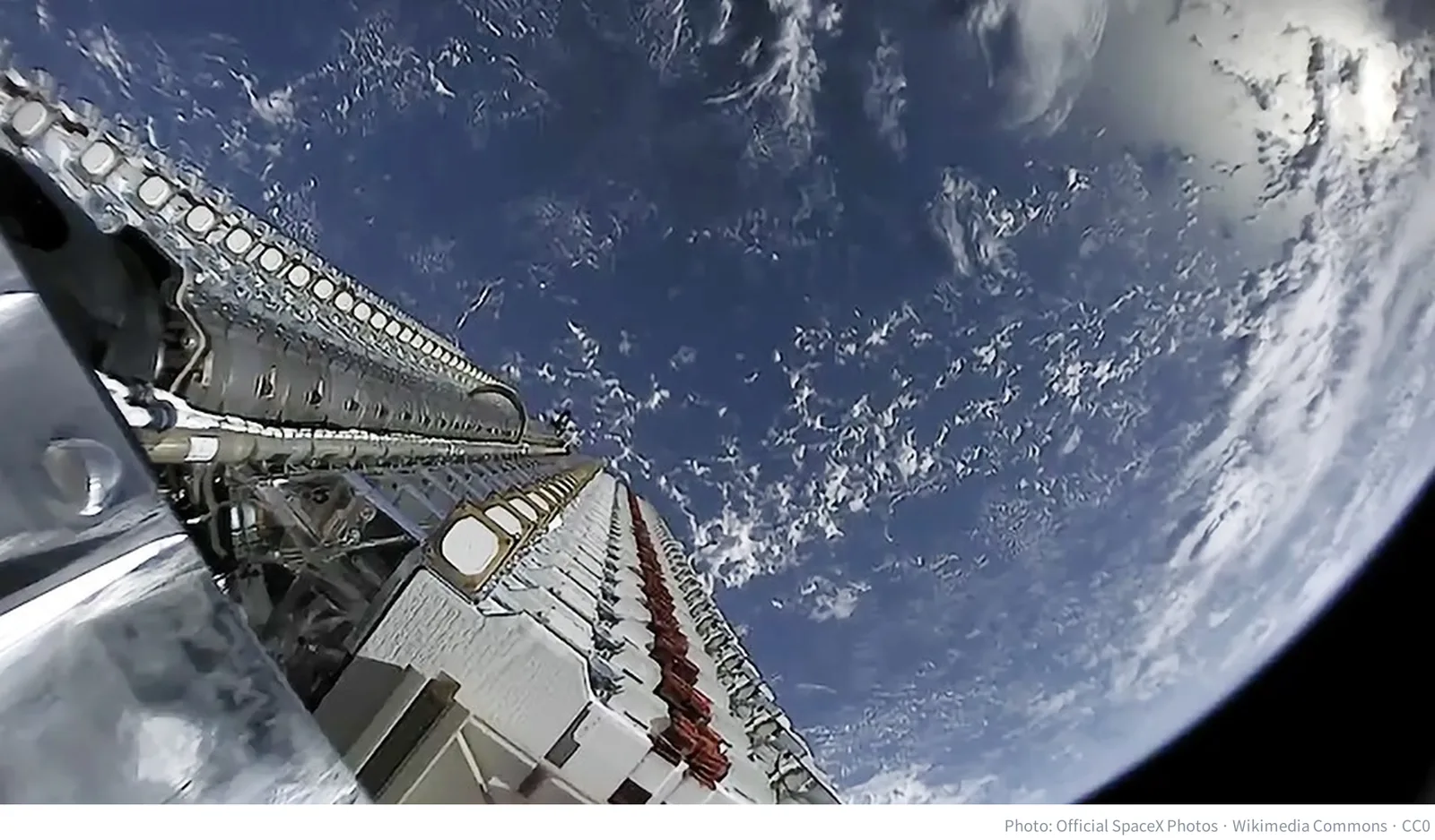A stack of Starlink satellites in orbit above Earth before deployment
