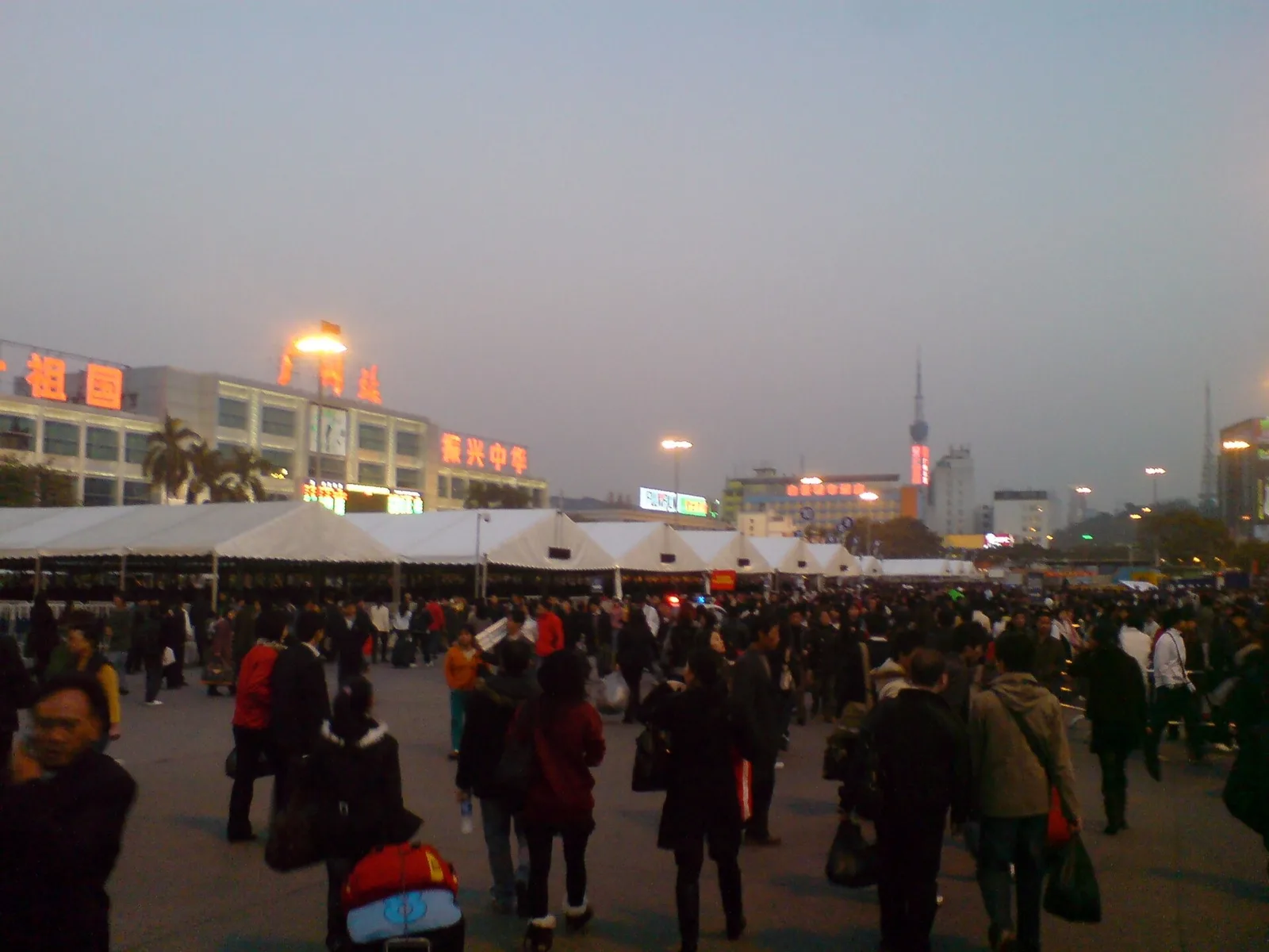 Crowds of travellers outside Guangzhou railway station during the Chinese New Year travel rush (chunyun)