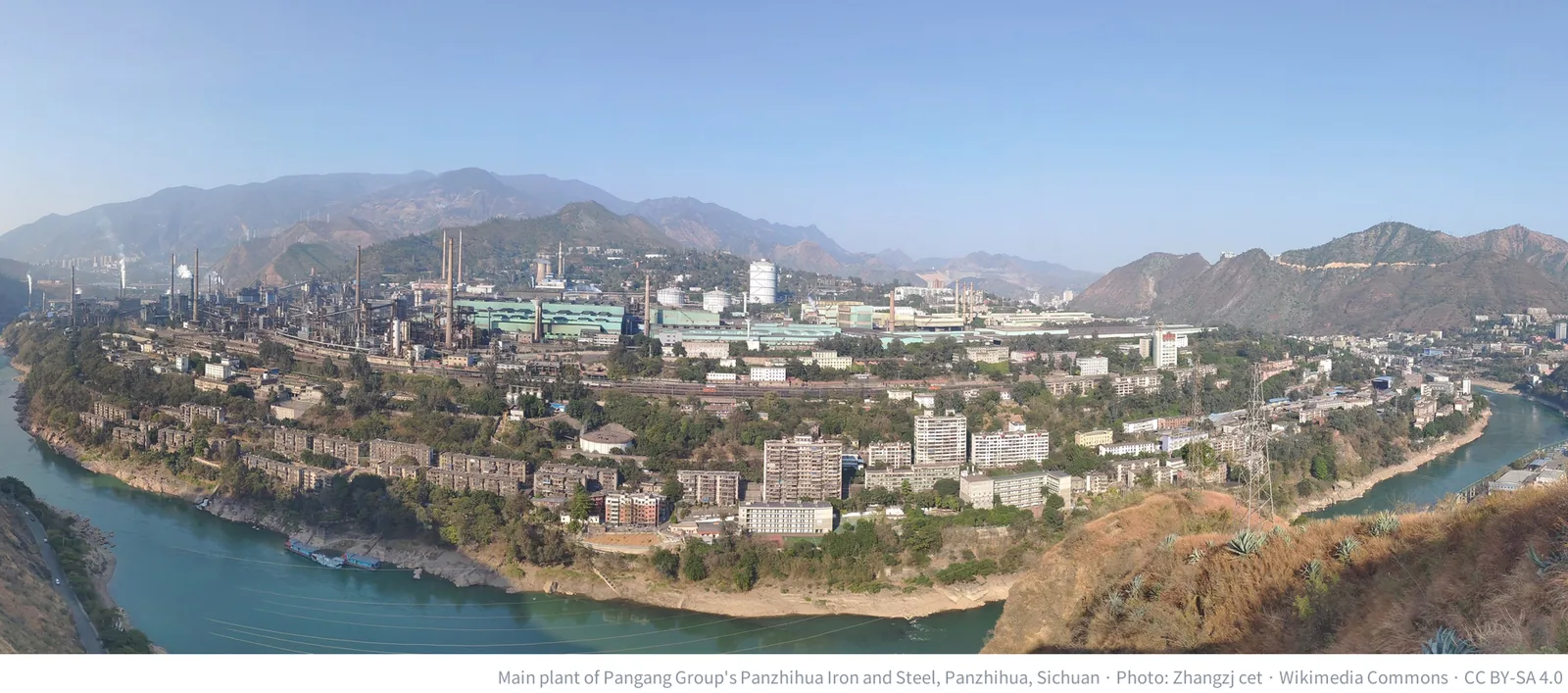 Main plant of Pangang Group's Panzhihua Iron and Steel in Sichuan, China, along a river valley