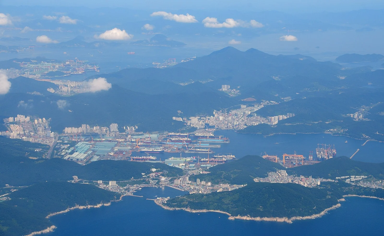 Aerial view of the Daewoo Shipbuilding & Marine Engineering shipyard in Okpo, Geoje, now Hanwha Ocean, with container ships and LNG carriers under construction in August 2017