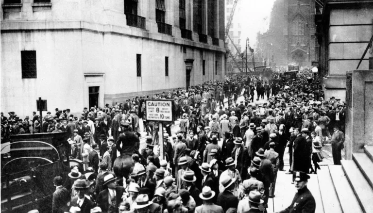 Crowds gathering on Wall Street outside the New York Stock Exchange during the October 1929 crash
