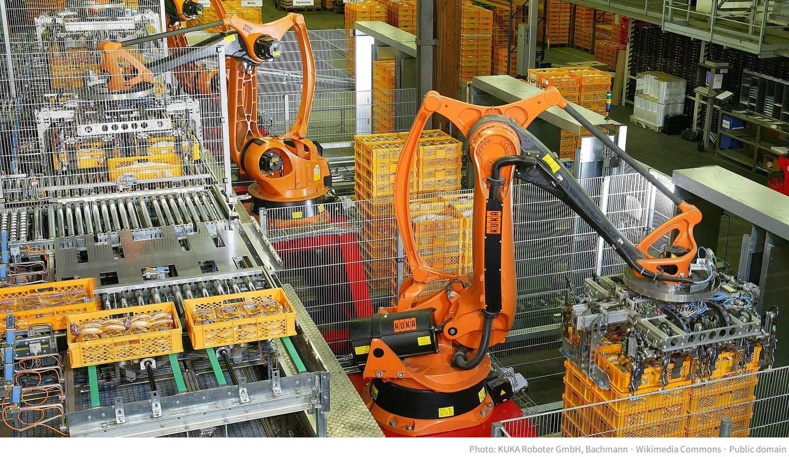 Industrial robots palletizing bread in a factory