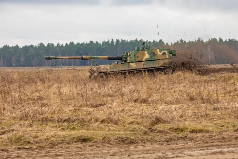 A Polish Army K9 self-propelled howitzer, built by Hanwha Aerospace, maneuvering on a firing range in Poland