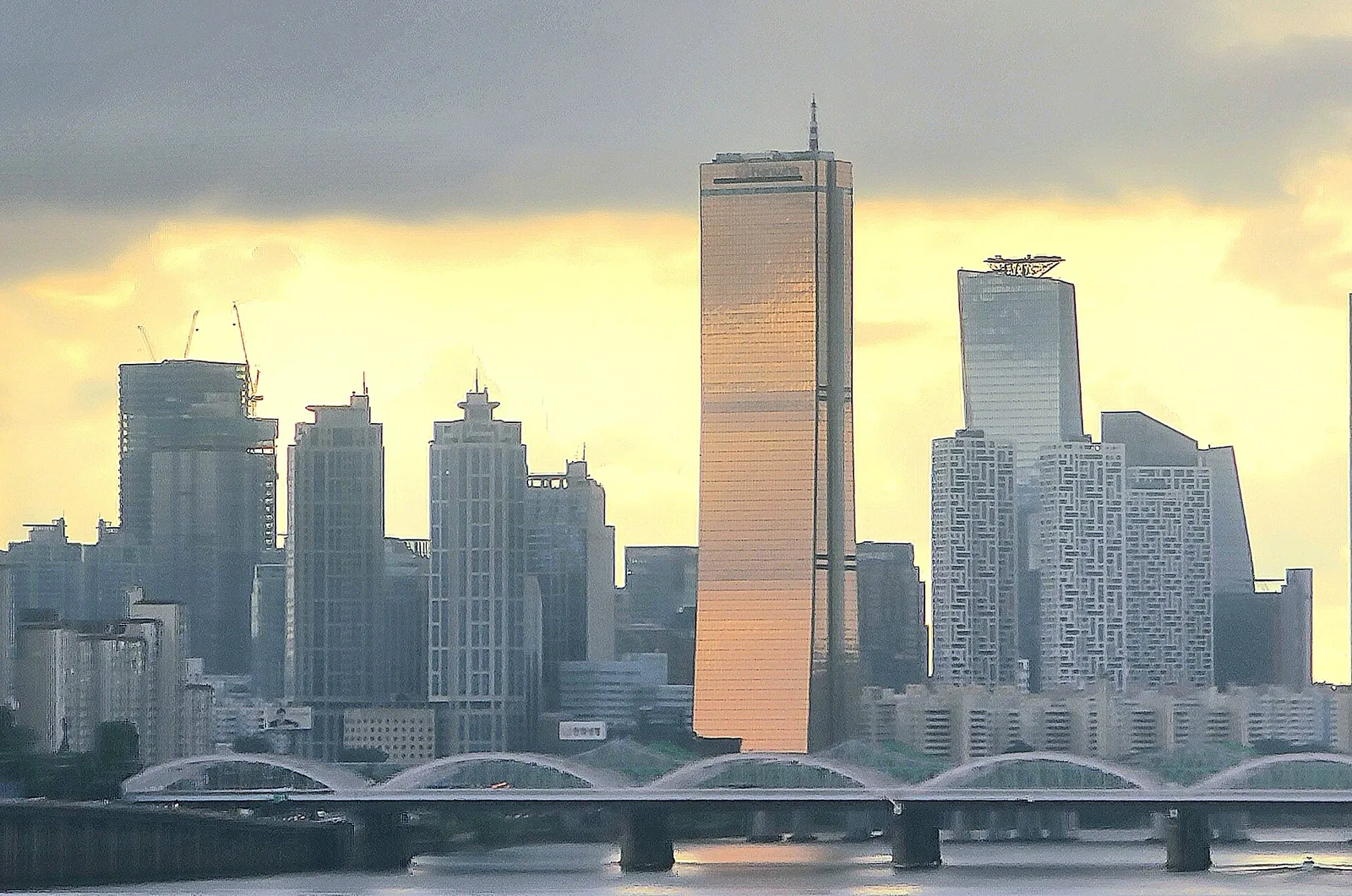 Yeouido skyline, Seoul's financial district, at sunset with the golden 63 Building, seen from Dongjak Bridge.